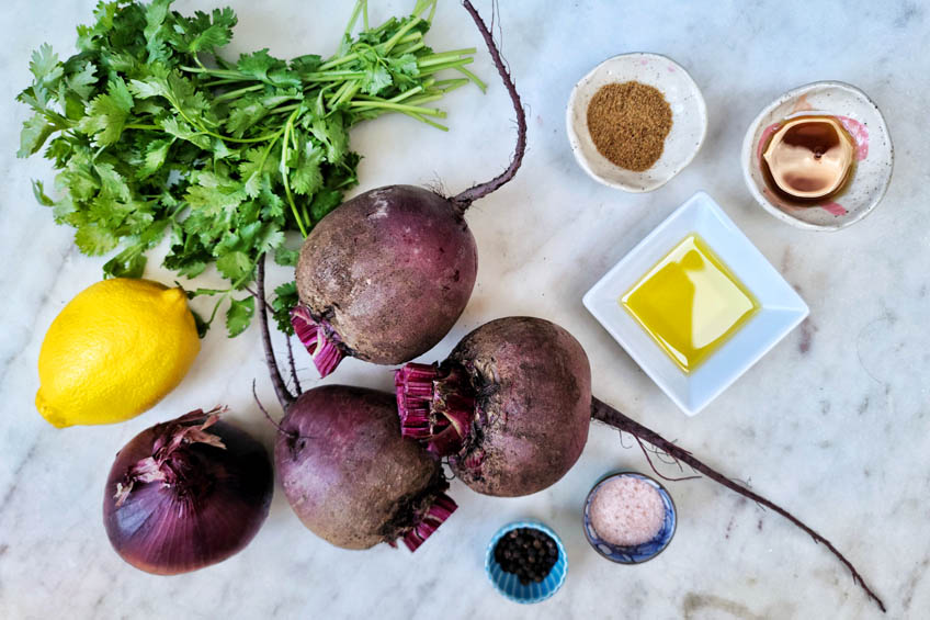 ingredients for moroccan beet salad on a marble countertop