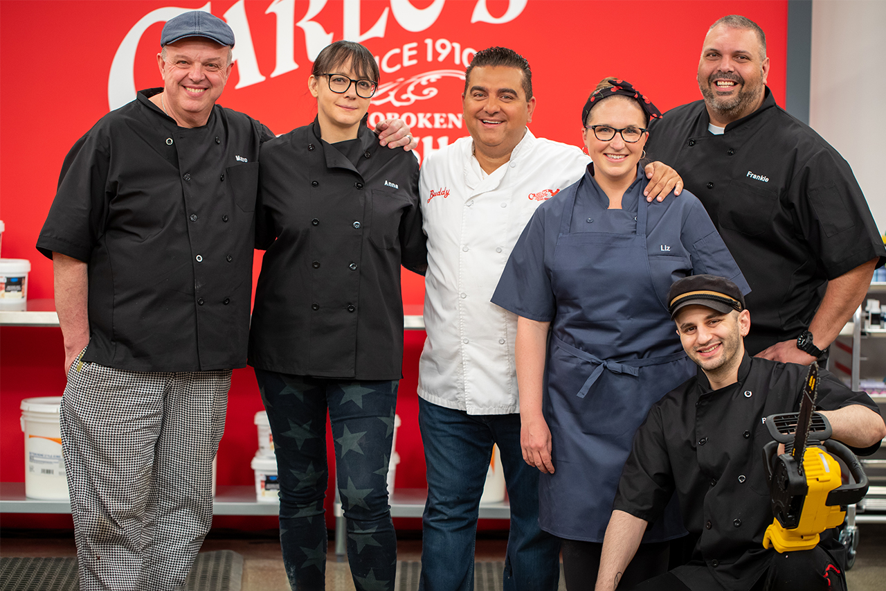 Buddy Valastro and his Carlo's Bakery team pose for a photo after winning Season 3 of Buddy vs. Duff
