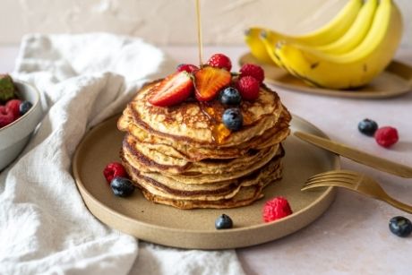Chickpea pancakes with fruit and maple syrup