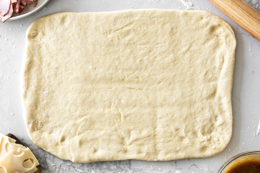 dough for croque madame rolls rolled into a flat rectangle