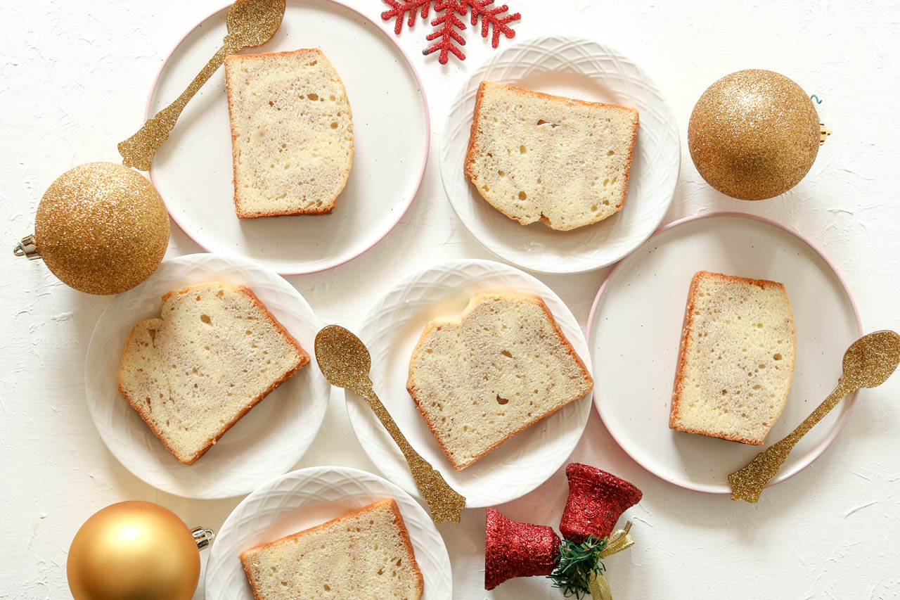 Slices of gingerbread spiced pound cake on white plates