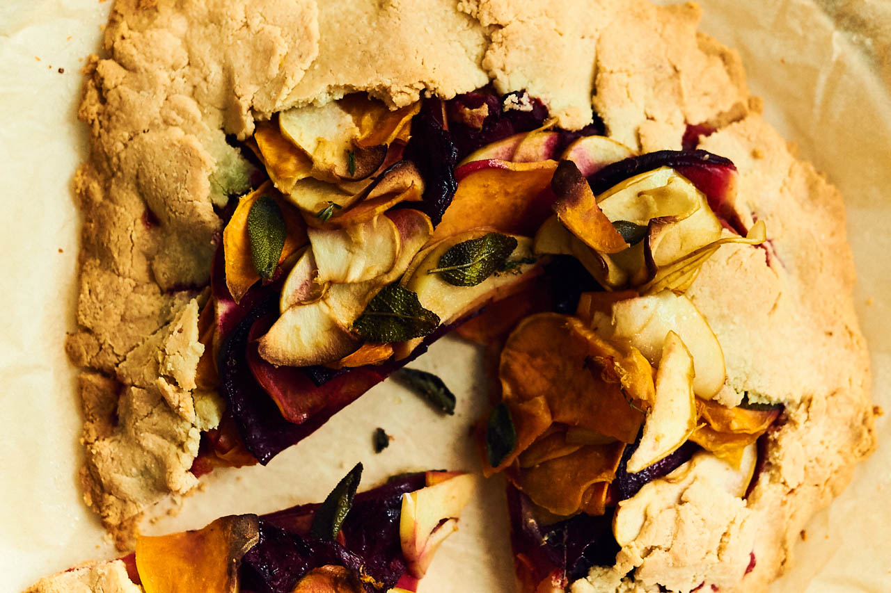 gluten-free sweet potato, beet and apple galette on parchment paper