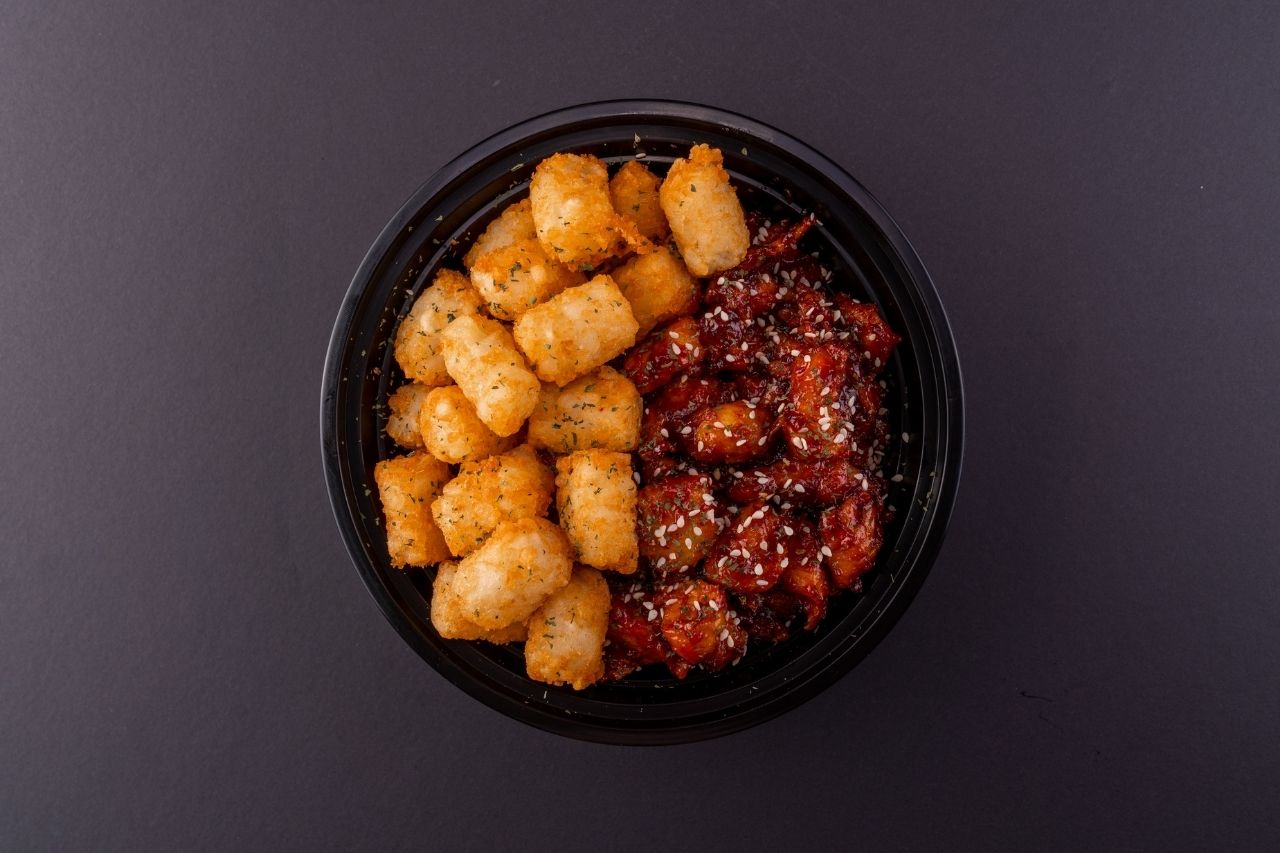 Aerial shot of Korean fried chicken and tater tots