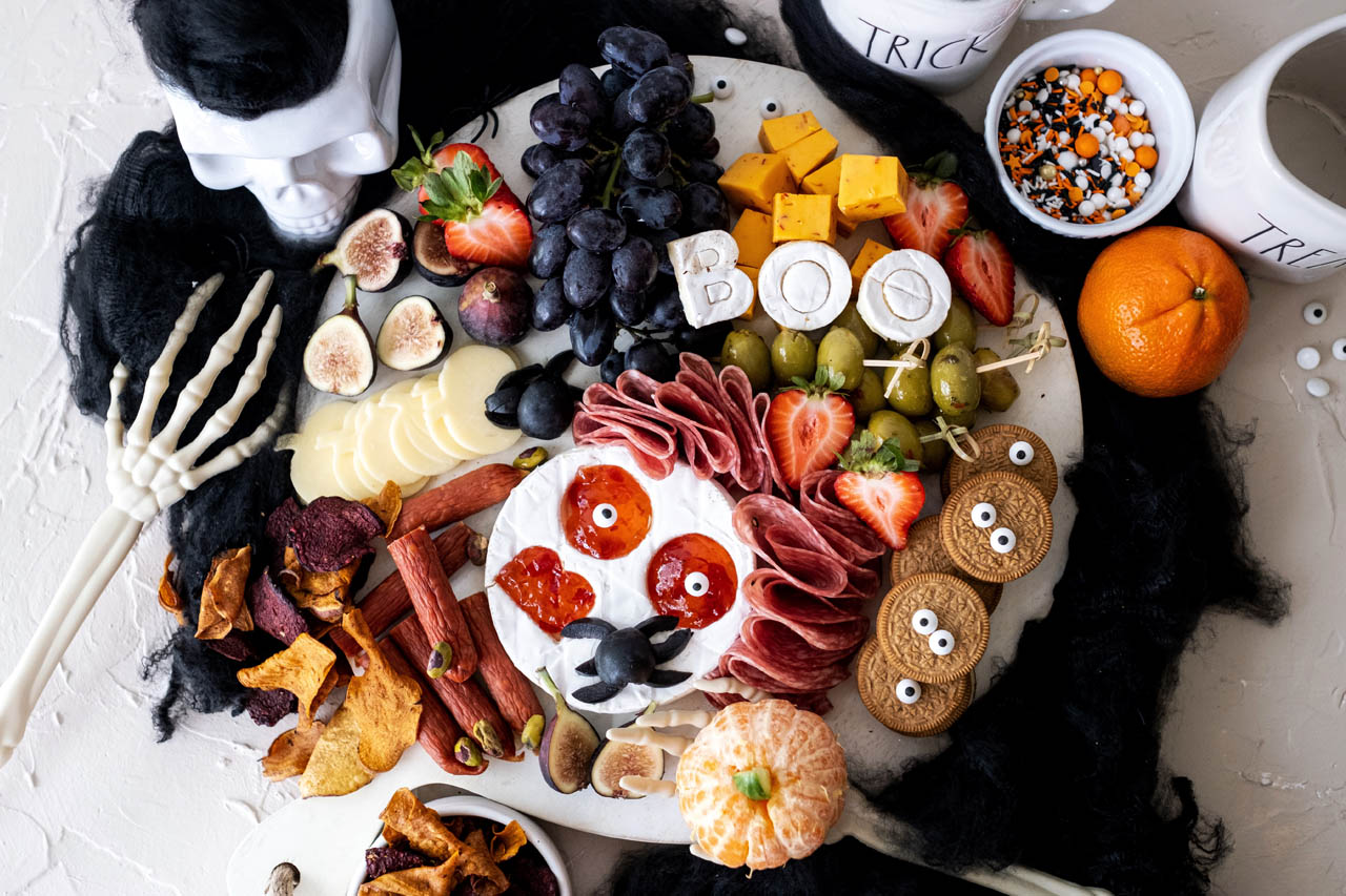 halloween charcuterie board with cheese, meat and fruit