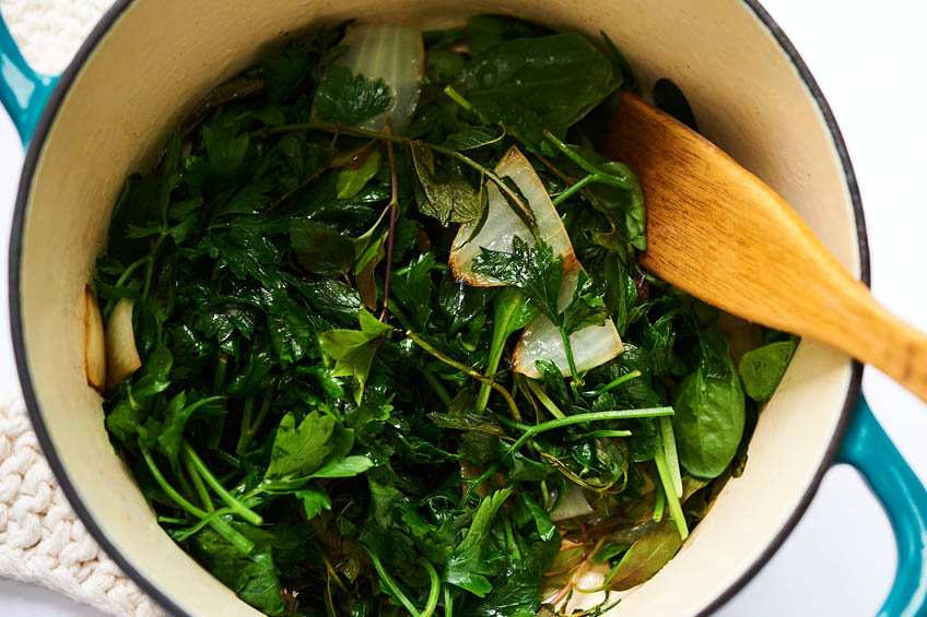 ingredients for herby green soup in a stock pot