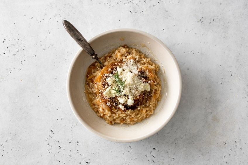 Caramelized risotto in white bowl