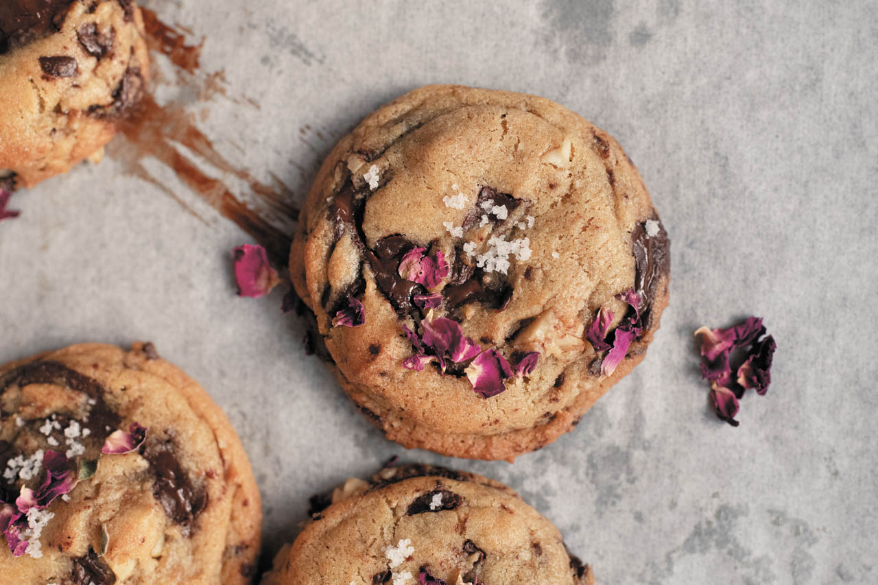 rose walnut chocolate chip cookies on parchment paper