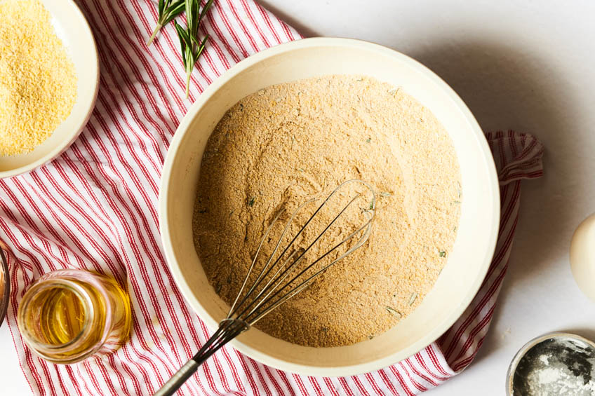 dry ingredients for vegan cornbread with rosemary and maple in a bowl