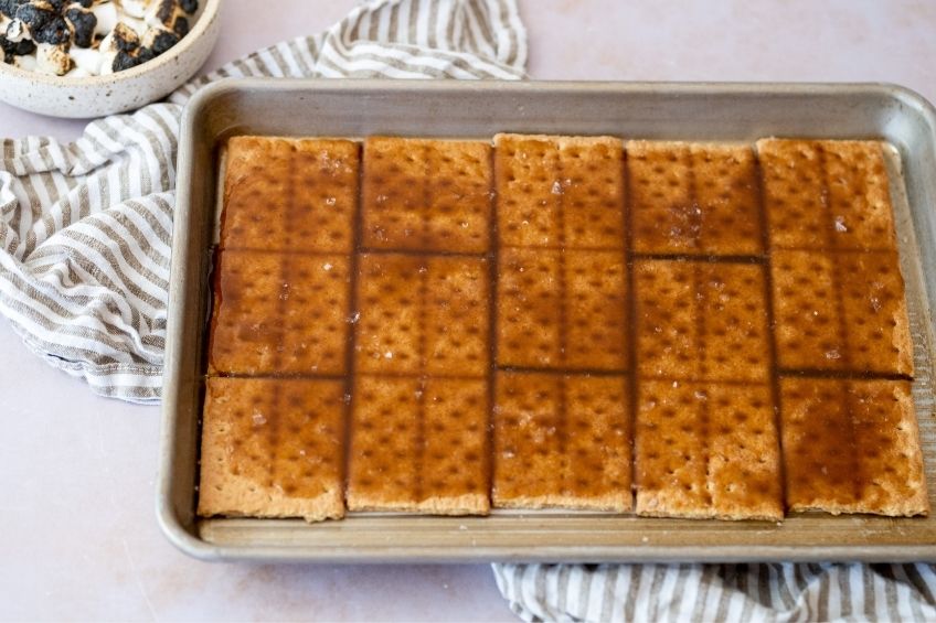 graham crackers laying on baking tray to make campfire s'mores ice cream