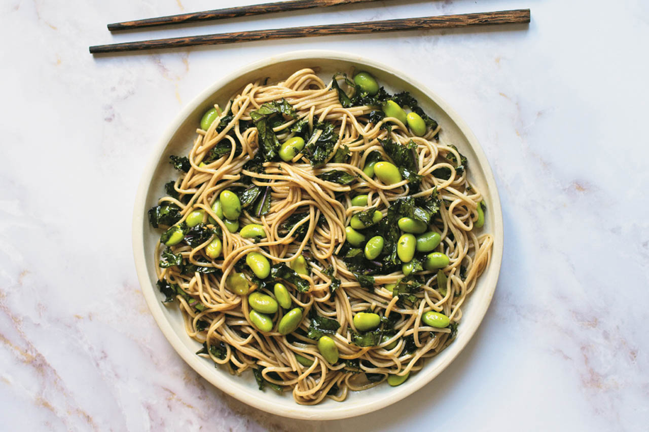 Sesame soba noodles with kale and edamame in a bowl