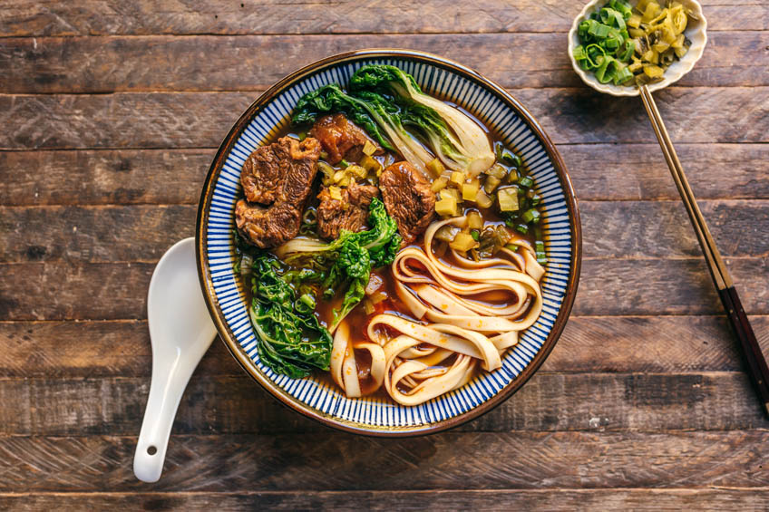 taiwanese beef noodle soup in a patterned bowl