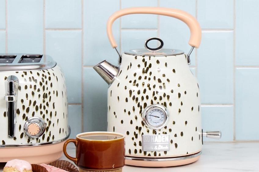 A white and black patterned electric kettle on a white counter.
