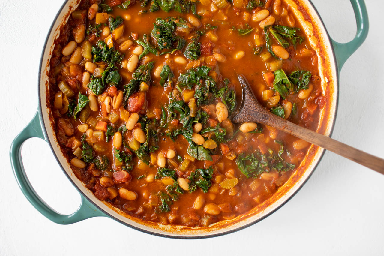 White bean and winter greens chili in a large pot.