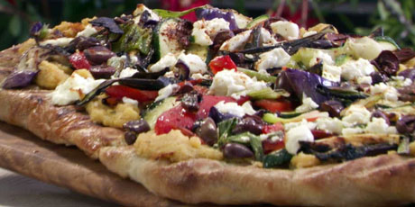 Grilled Pizza with Spicy Hummus, Vegetables, Goat Cheese and Black Olives