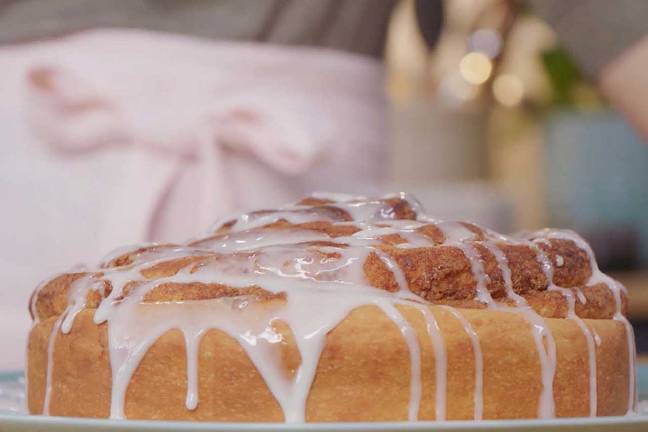 Close-up of a giant cinnamon roll with glaze