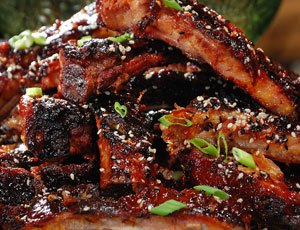 Asian Spice Rubbed Ribs with Pineapple-Ginger BBQ Sauce and Black and White Sesame Seeds