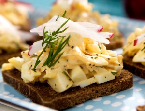 Open-Faced Egg Salad Tea Sandwiches with Crab and Poppy Seeds on Pumpernickel
