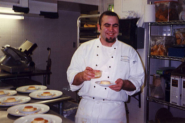 Duff in a kitchen with plates of dessert
