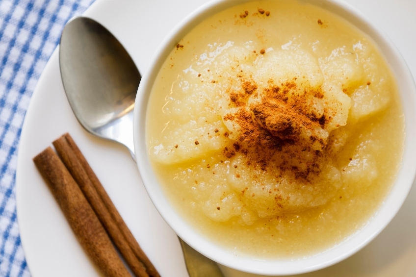 Applesauce in a bowl with a sprinkling of cinnamon