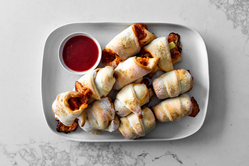 Hawaiian pigs in a blanket on a white plate