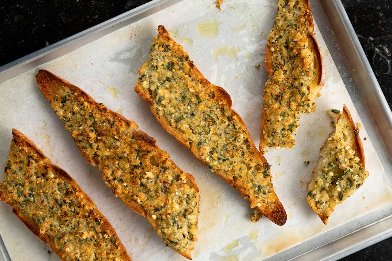 slices of garlic toast on a baking pan