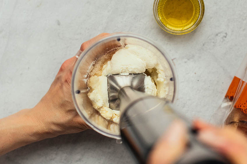 Ricotta being blended with an immersion blender