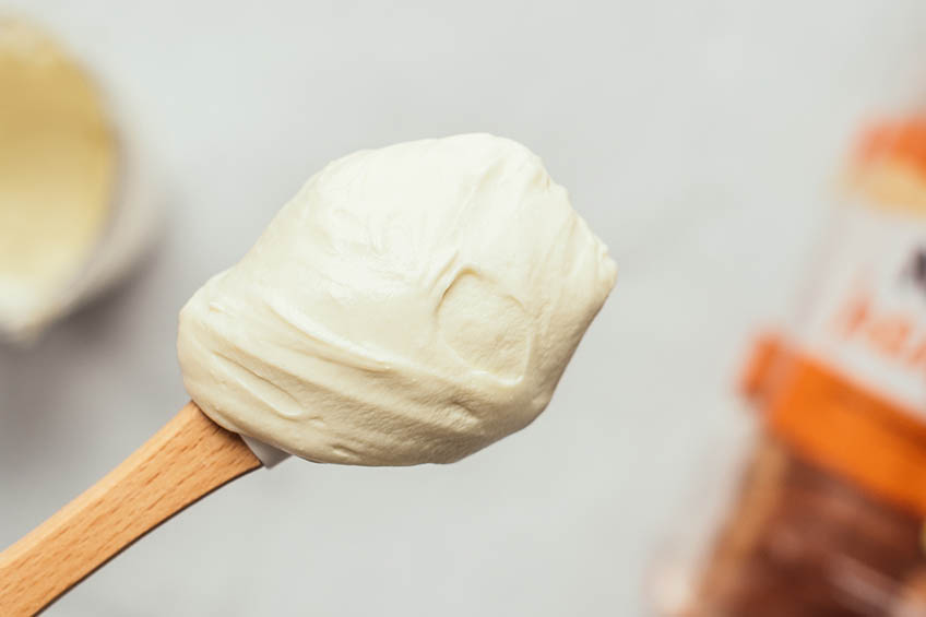 Smooth whipped ricotta on a spoon