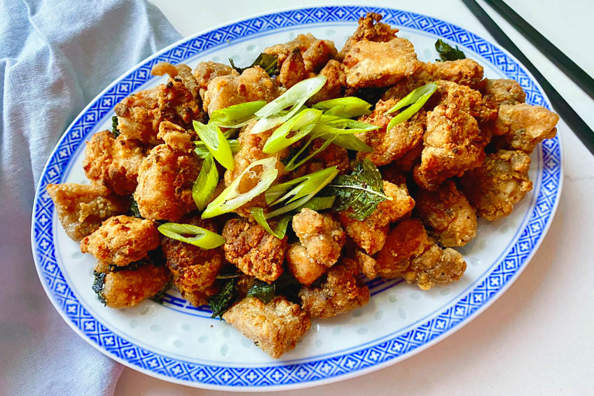 Air fryer Taiwanese popcorn chicken on a blue patterned plate