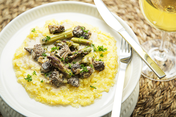 Stewed Morels, Ramps and Asparagus Over Grits via Getty Images