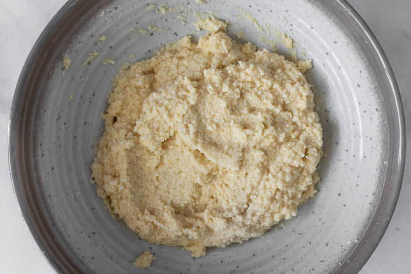 Batter for almond ricotta cake in a bowl