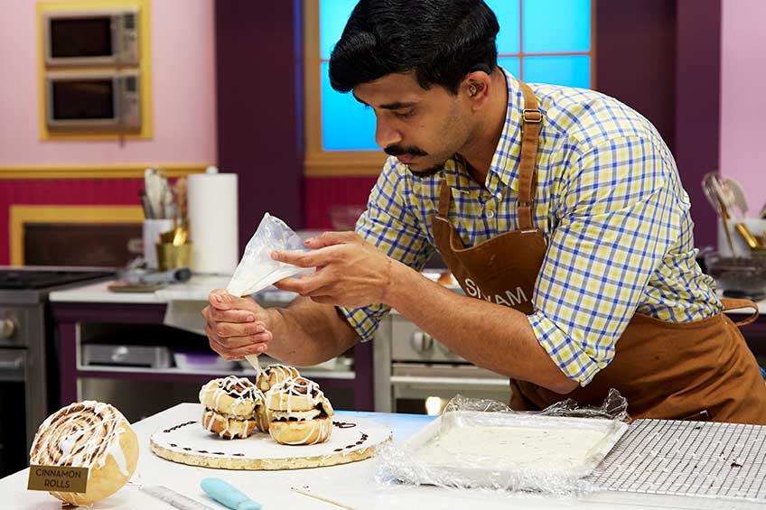 Shyam working on his cinnamon rolls on the set of Great Chocolate Showdown