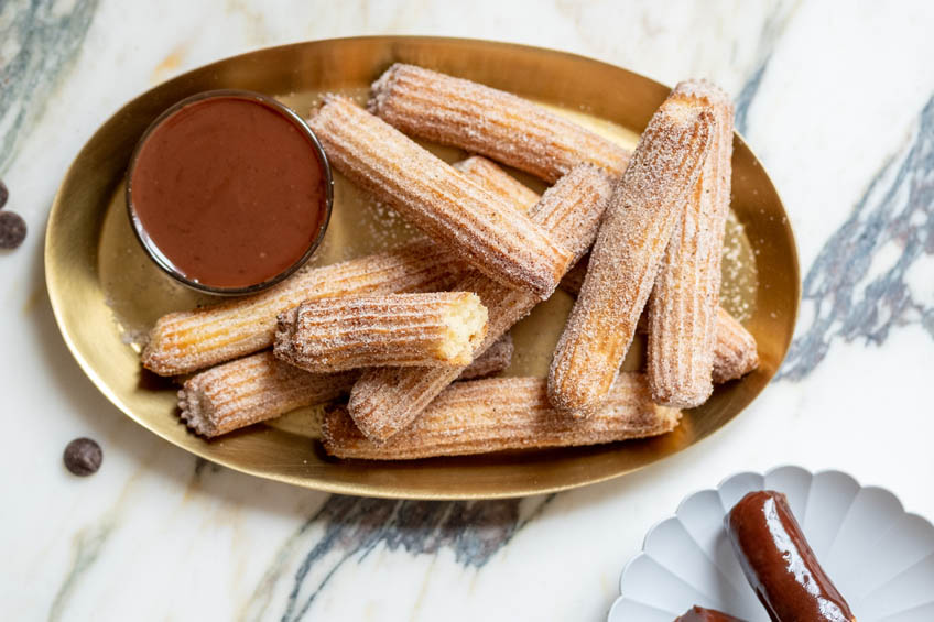 Air fryer churros with chocolate tahini dip on the side