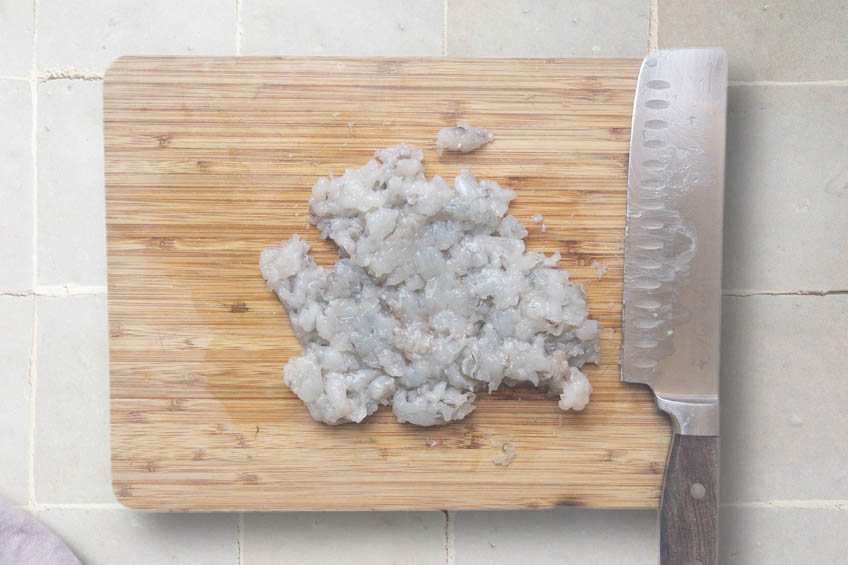 Chopped shrimp on a cutting board