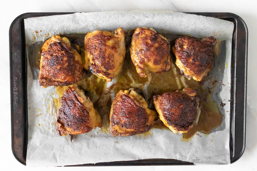 Baked chicken thighs on a sheet pan