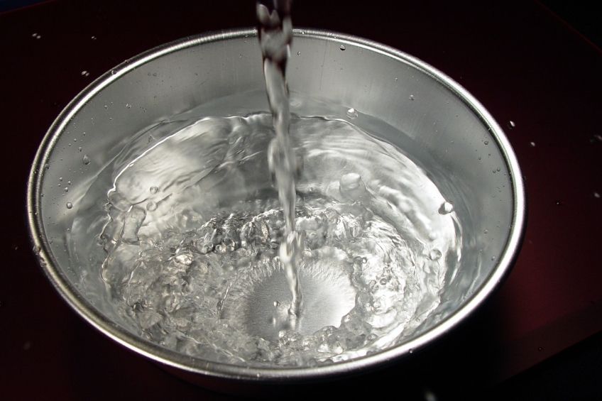 water being poured into a pan