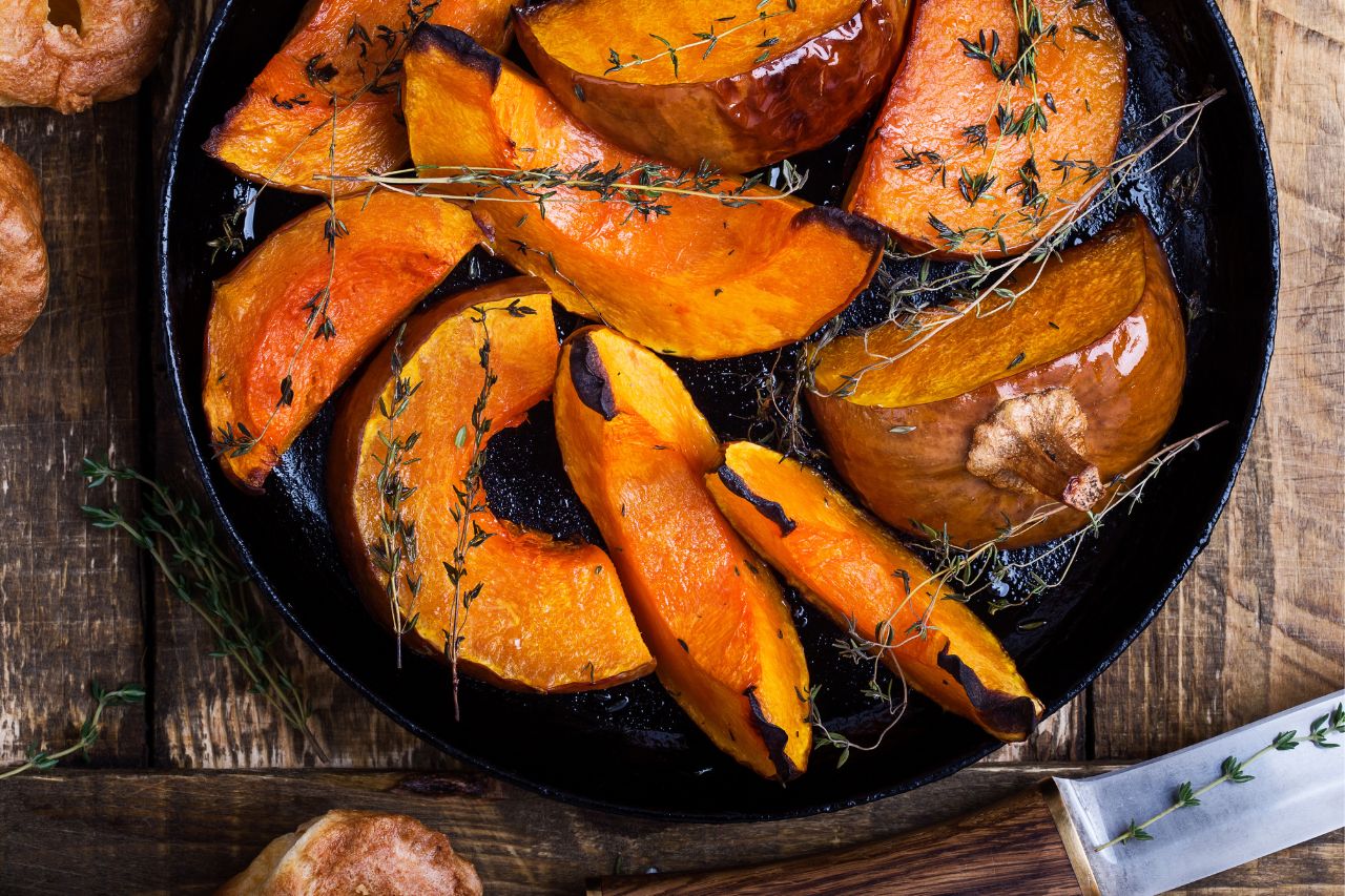 baked pumpkins in a cast iron pan