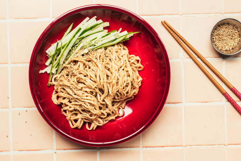Chinese cold sesame noodles with cucumber in a bowl