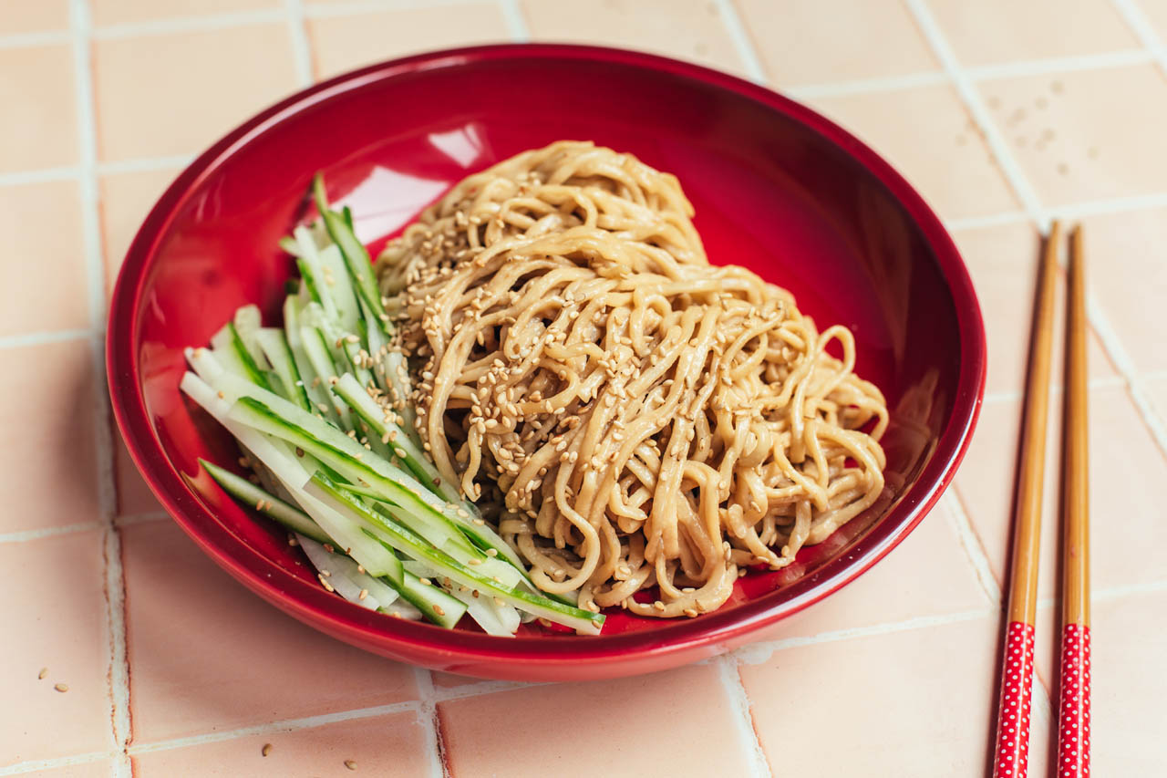 Chinese cold sesame noodles with cucumber in a bowl