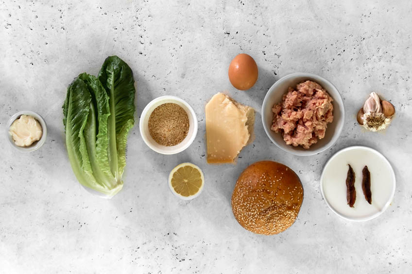 Ingredients for chicken Caesar salad burger