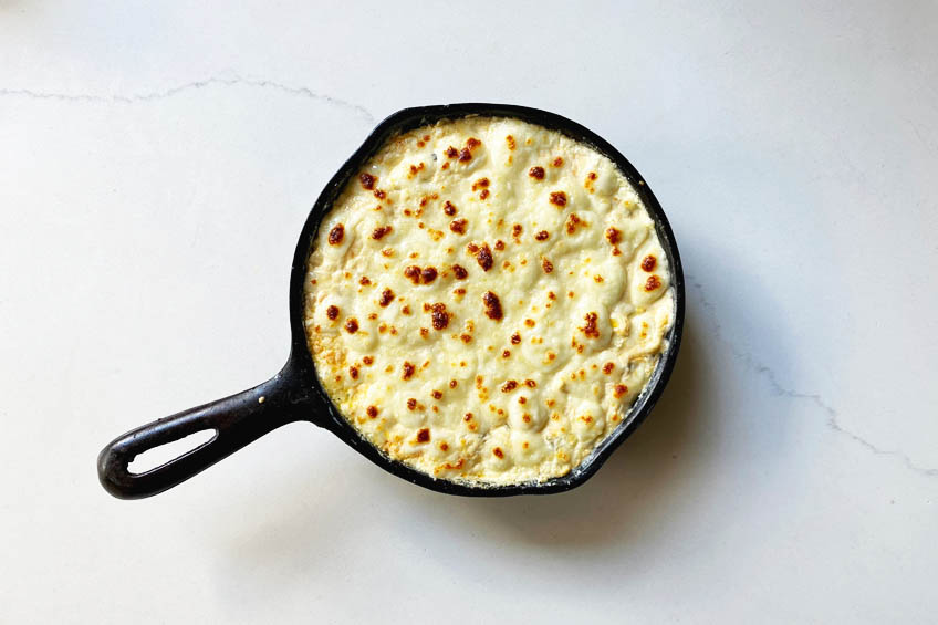 Mexican street corn dip topped with golden queso fresco