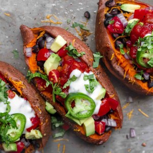 Vegan Loaded Sweet Potatoes with Cheese and Beans