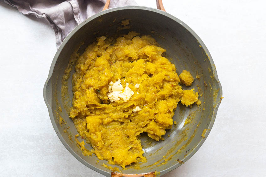 Acorn squash curry in a pan