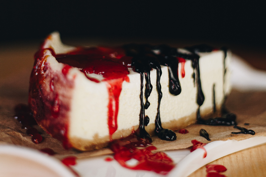 NY cheesecake topped with berry sauces