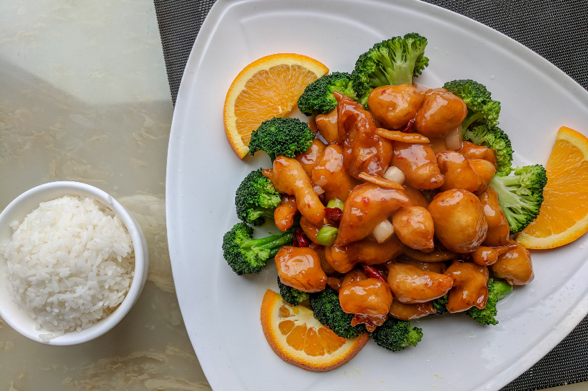 Overhead shot of sweet and sour chicken with broccoli