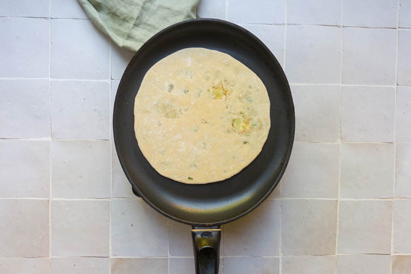 Aloo paratha in a pan
