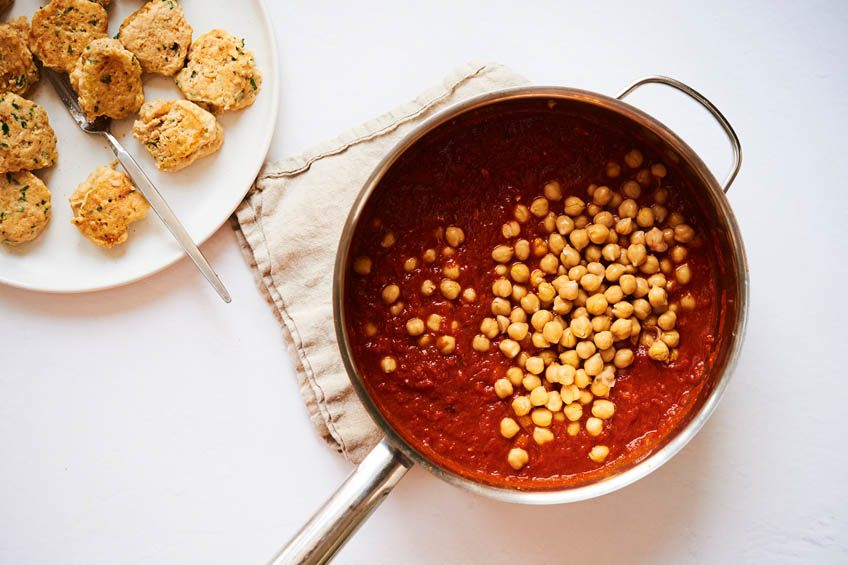 Tomato sauce and chickpeas in a saute pan