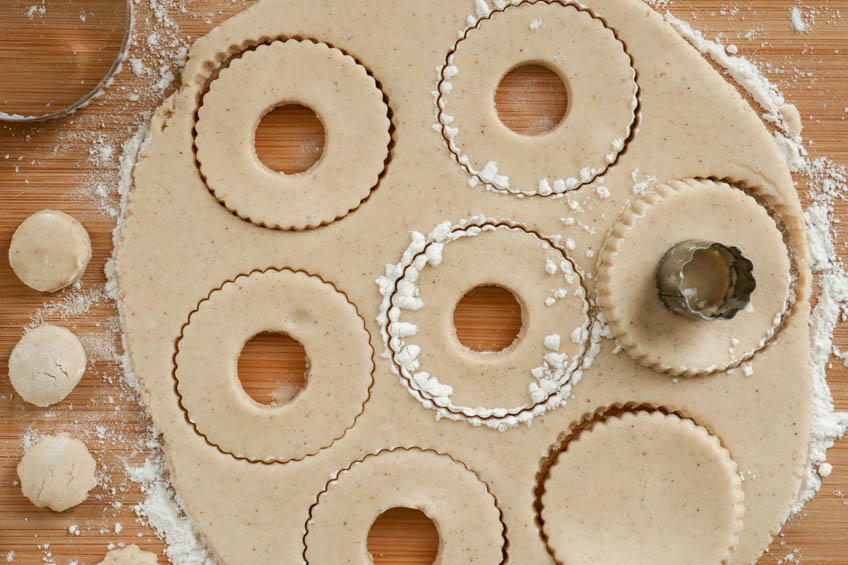 Cutouts for Gingerbread Spiced Shortbread Wreath Cookies in progress