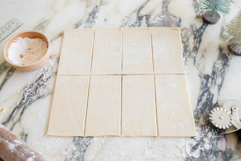 A sheet of puff pastry cut into 8 rectangles