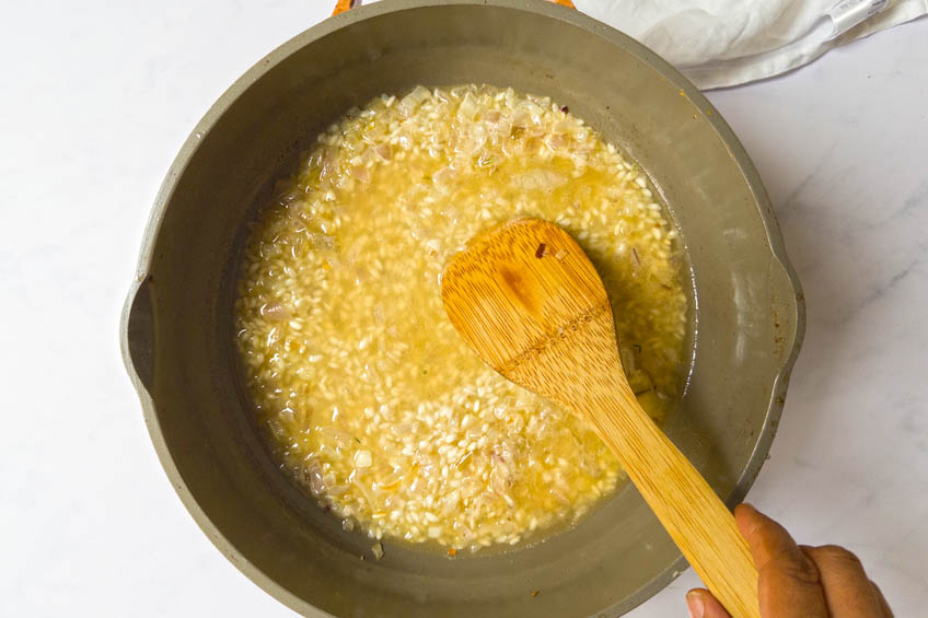 Rice and broth in a saute pan