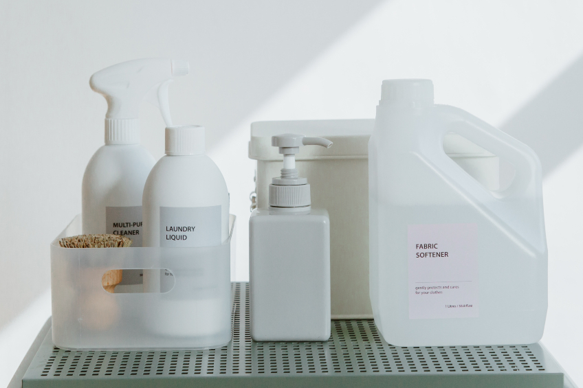 Household cleaning products in white containers